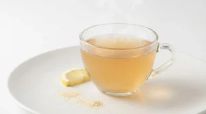 Gelatin Trick Recipe for Weight Loss: Complete Guide (Does It Work?) 3 Warm gelatin trick drink in clear glass showing proper preparation for weight loss