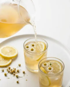 Kombucha Gut Health And Probiotics For Happier Digestion 4 Chamomile kombucha tonic being poured to serve as a gentle kombucha gut health drink