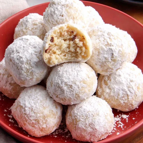 Delicious Snowball Cookies That Melt in Your Mouth 1 Delicious Snowball Cookies coated in powdered sugar.