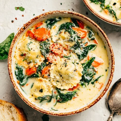 Delicious creamy soup with ravioli and spinach.