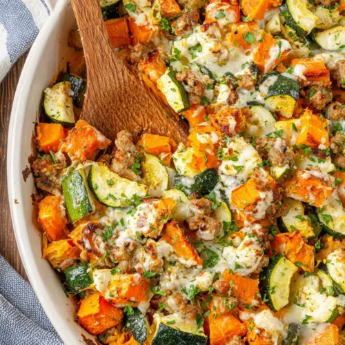Turkey sweet potato bake with ground turkey, zucchini, melted cheese and parsley