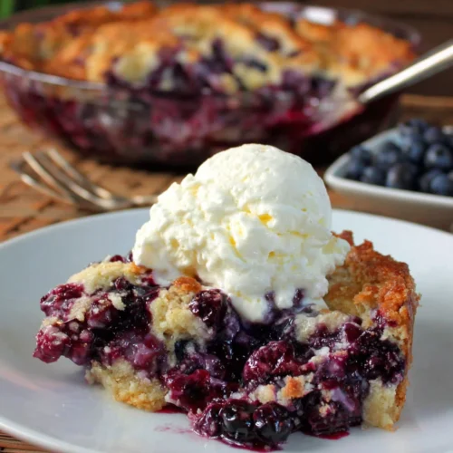 Blueberry Cobbler: A Delightfully Easy Dessert 1 Delicious blueberry cobbler dessert with whipped cream