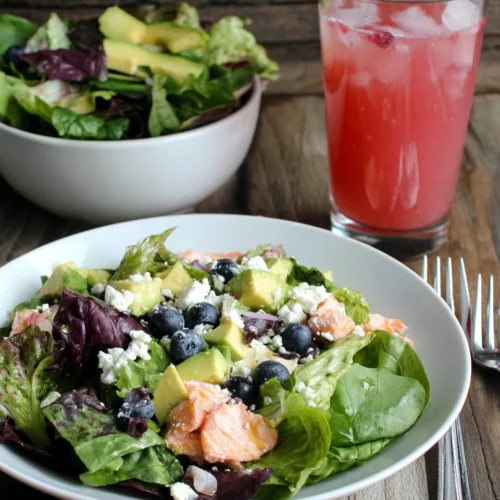 Colorful blueberry salad with fresh greens, perfect for gatherings.