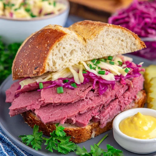 Corned beef brisket sandwich served with mustard and slaw.