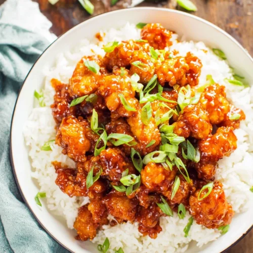 Spicy and sweet firecracker chicken served with rice.