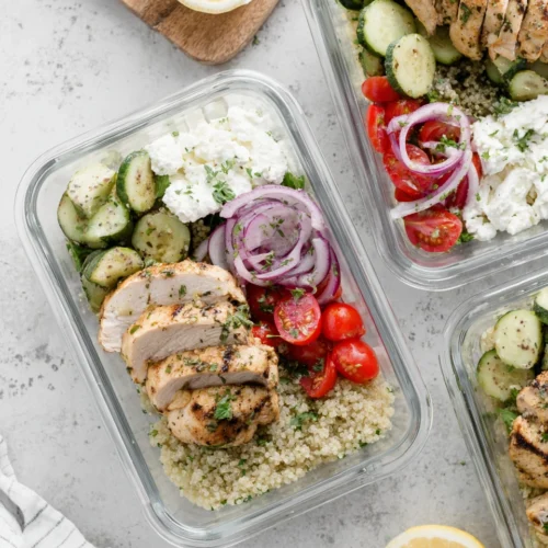 Greek chicken meal prep with quinoa and fresh veggies