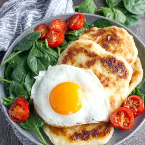 Delicious Irish potato farls with greens and tomatoes for breakfast