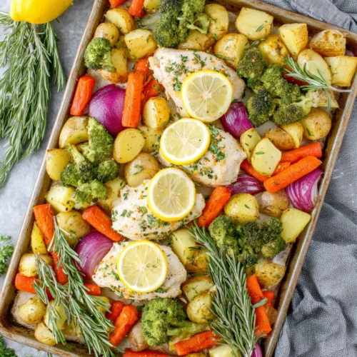 Juicy lemon garlic chicken with colorful roasted vegetables.