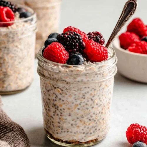 Healthy overnight oats topped with berries, perfect for breakfast.