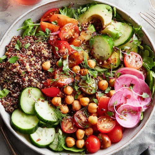 Delicious Quinoa Bowl: A Healthy Family Favorite 1 Delicious quinoa bowl filled with fresh veggies and smoky chickpeas.