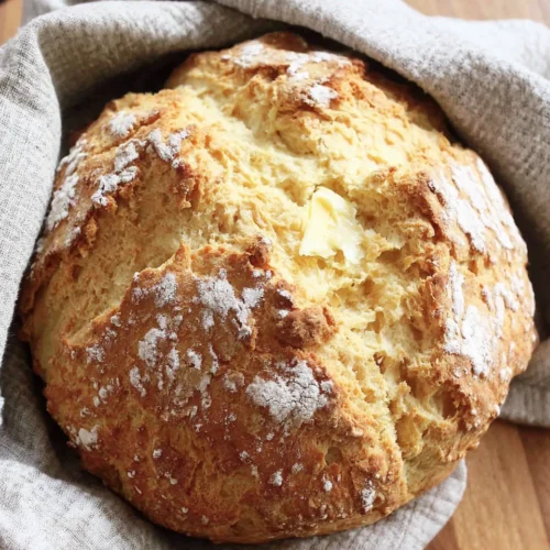 Homemade soda bread with a soft crumb and rustic crust.