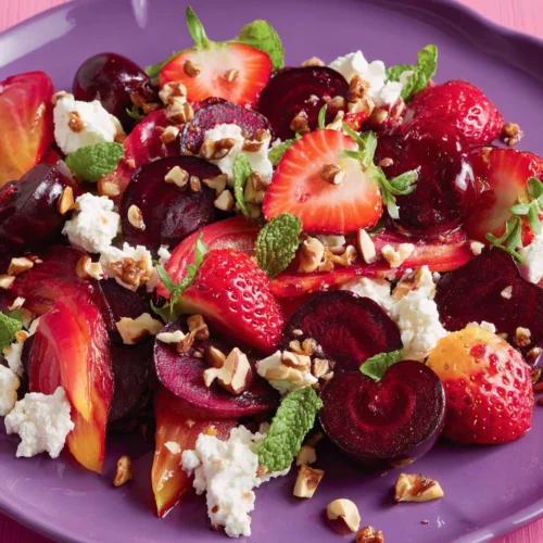 Delicious spring beet salad with fruits and goat cheese.