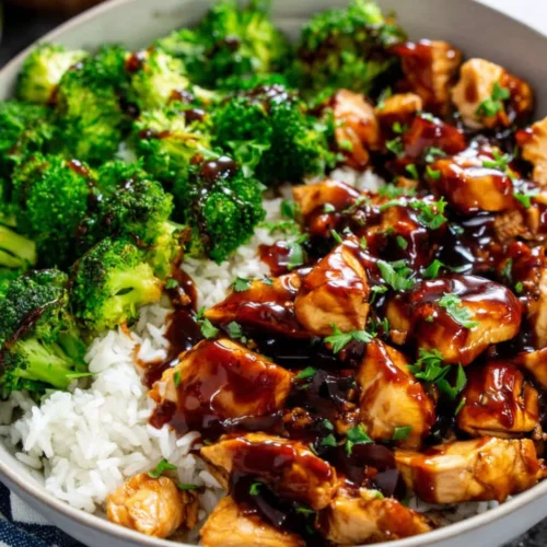 Sticky Chicken Rice Bowls: A Delightfully Easy Recipe 1 Sticky chicken rice bowls with broccoli and savory sauce.