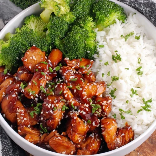 Teriyaki chicken bowl with rice and broccoli.