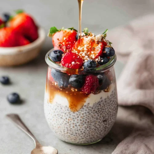 Yogurt Chia Pudding: A Creamy Breakfast Delight 1 Yogurt chia pudding with berries and honey drizzle.