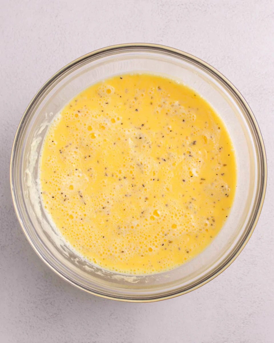 Whisked Eggs for Casserole Hash Browns and Eggs Whisked eggs prepared for casserole hash browns and eggs.