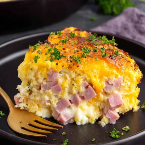 Savory ham egg and cheese bake on a plate.