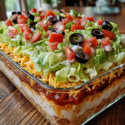 Delicious 7 layer dip with fresh toppings.
