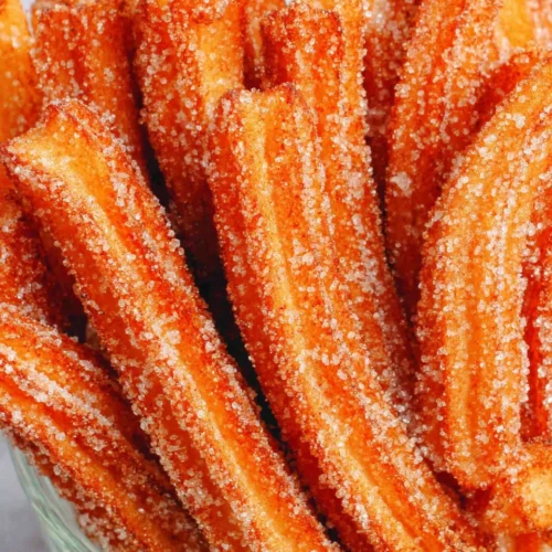 Authentic Churros: Crispy, Sweet, and Irresistibly Delicious 1 Delicious authentic churros with cinnamon sugar coating