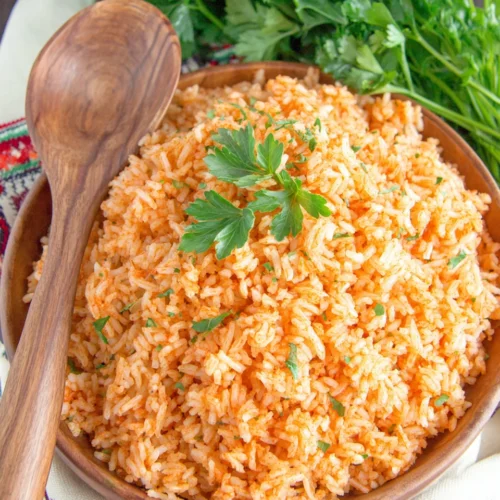 Delicious authentic Mexican rice served with parsley garnish.