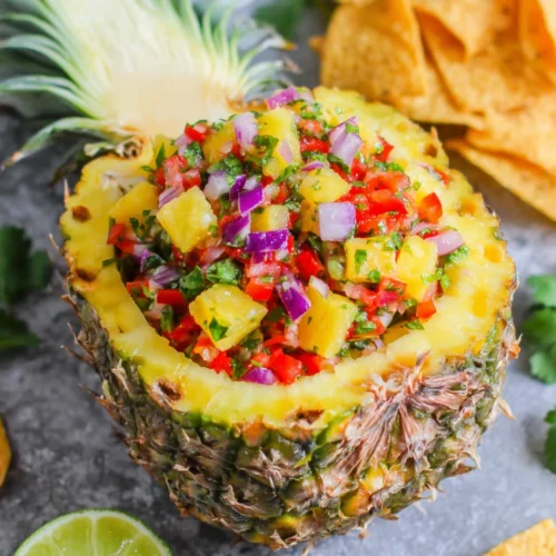 Delicious pineapple salsa in a pineapple bowl for cinco de mayo party.