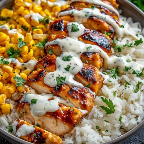 High protein BBQ ranch chicken bowl with grilled chicken, rice, corn, and creamy sauce