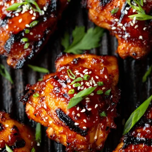 Korean Grilled Chicken Thighs: A Flavorful Delight 1 Korean grilled chicken thighs with sesame seeds and green onions