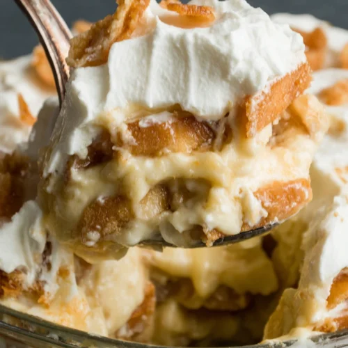 Old-fashioned banana pudding with vanilla wafers and whipped cream