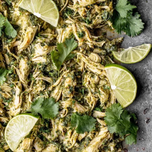 Sheet pan salsa verde chicken dish with cilantro topping.
