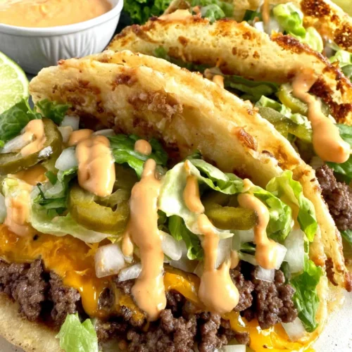 Big Mac Smash Burger Taco: A Fun and Flavorful Twist 1 Big Mac Smash Burger Tacos with cheese, lettuce, onions, and sauce