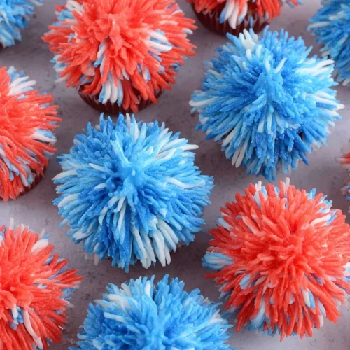 Easy fireworks cupcakes with red, white, and blue frosting in a fireworks design