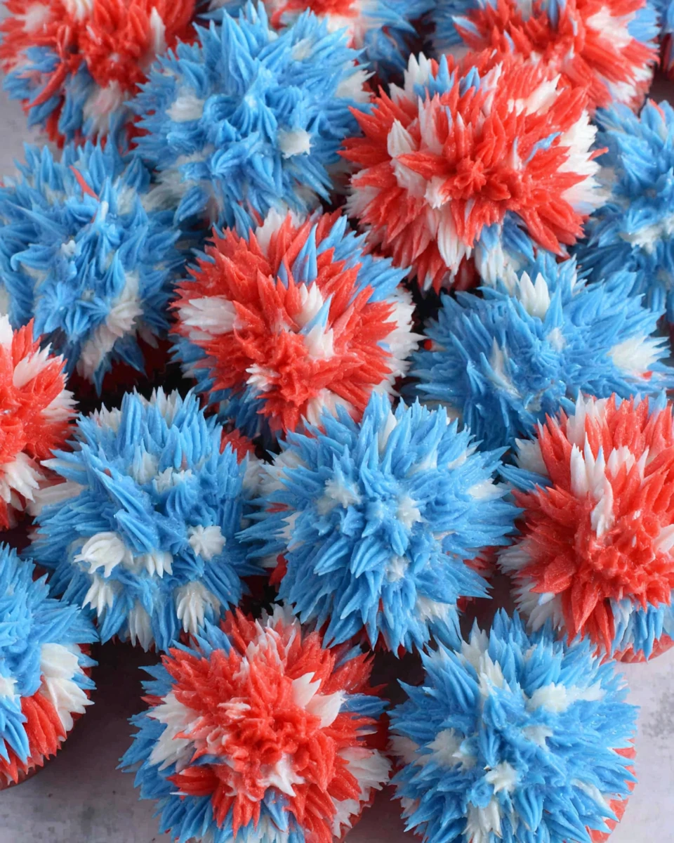 Easy fireworks cupcakes with red, white, and blue frosting in a festive design