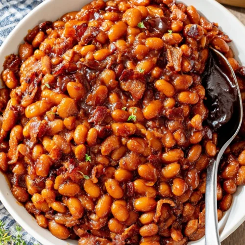 Easy instant pot baked beans in a white bowl with spoon