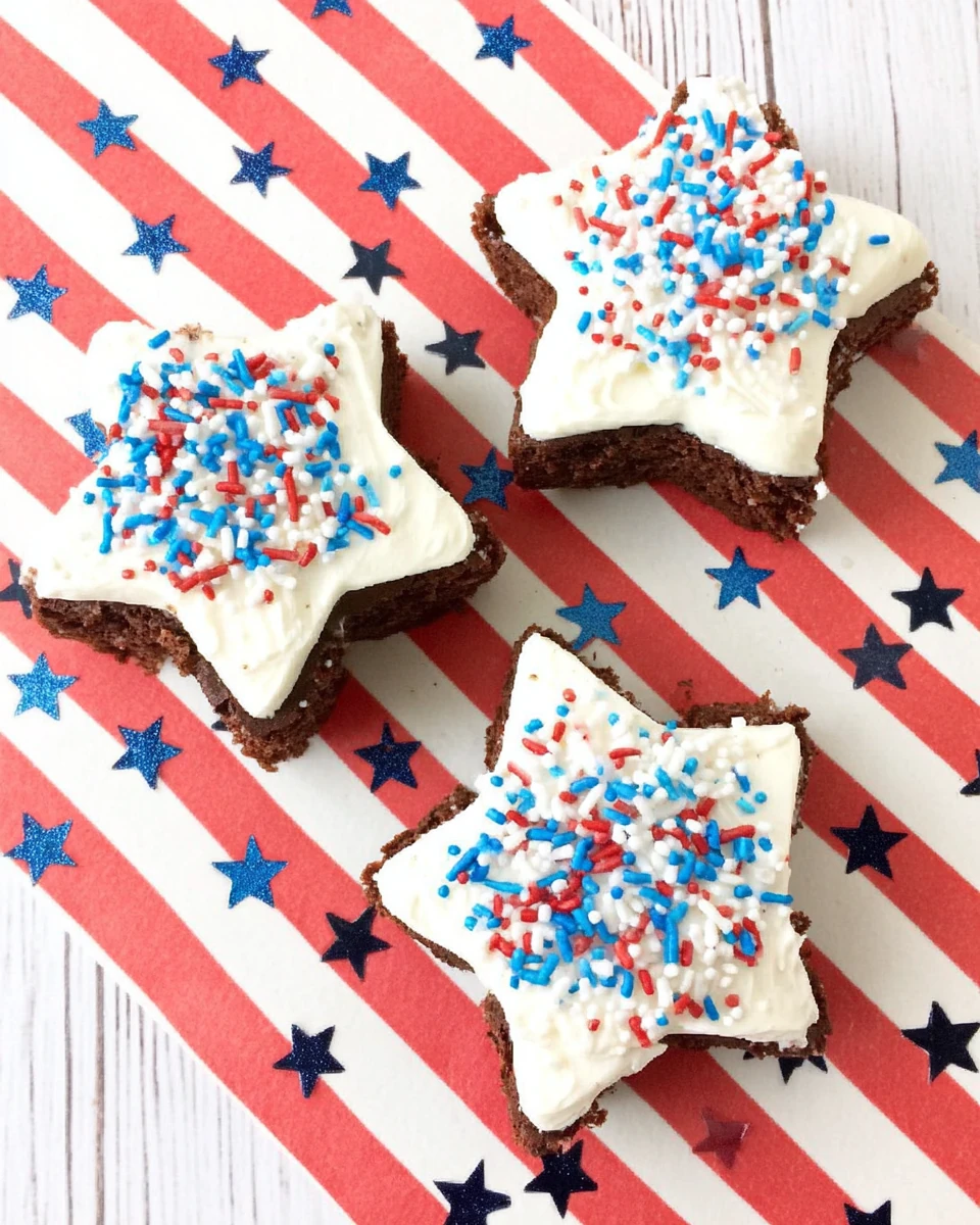 Patriotic star brownies with red, white, and blue sprinkles on a festive background