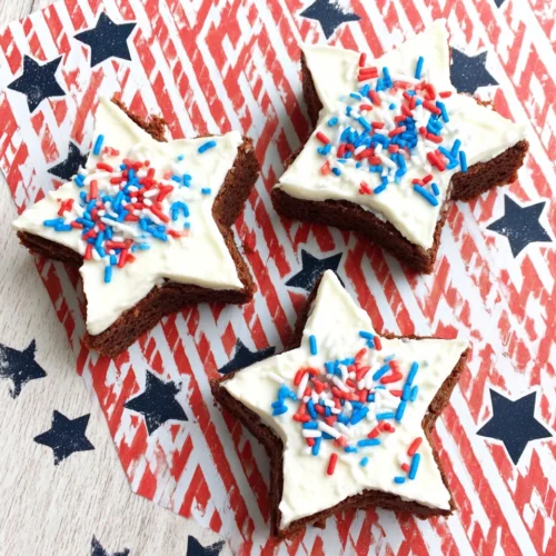 Patriotic star brownies with red, white, and blue sprinkles on a festive background