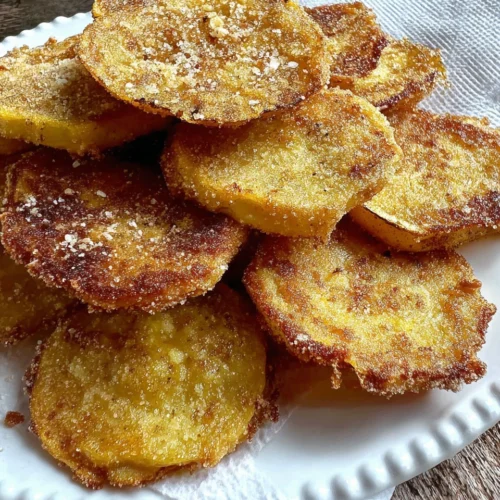 Crispy southern fried yellow squash on a white plate