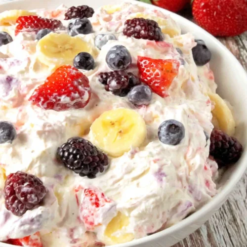Summer berry cheesecake salad with fresh berries and creamy texture