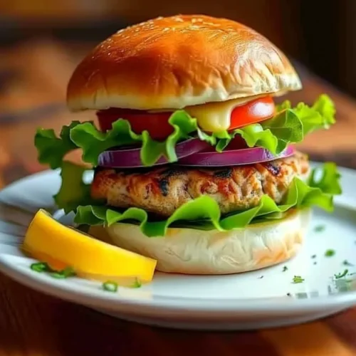 Juicy turkey burger with fresh vegetables and cheese on a plate