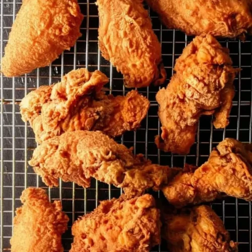 Crispy southern fried chicken wings on a cooling rack