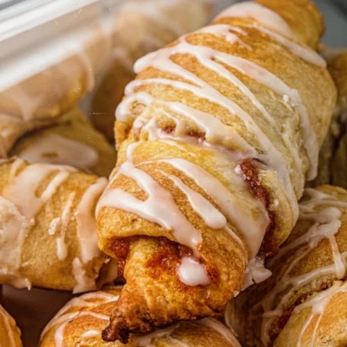 Cream cheese pumpkin pie crescent rolls with maple glaze, golden and flaky